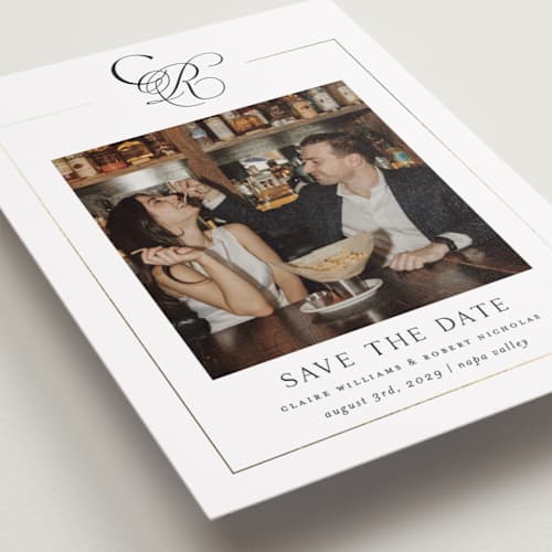 This is a silk foil stamped save the date cards with foil pressed by Kelly Schmidt called monogram script printing on recycled smooth signature in standard