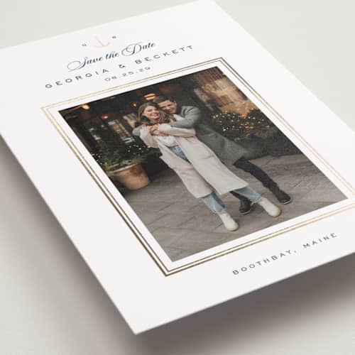 This is a royal navy foil stamped save the date cards with foil pressed by Olivia Raufman called anchored printing on recycled smooth signature in standard