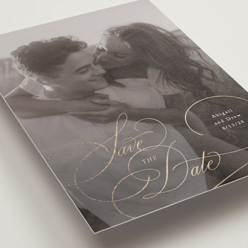 This is a cream foil stamped save the date cards with foil pressed by Hooray Creative called elegantly scripted printing on recycled smooth signature in standard