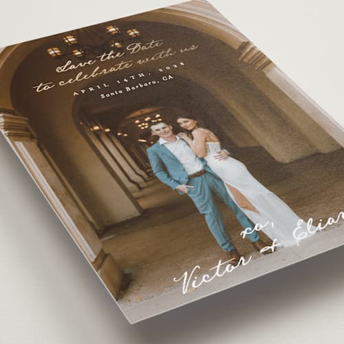 This is a ivory foil stamped save the date cards with foil pressed by Alethea and Ruth called celebration xo printing on recycled smooth signature in standard