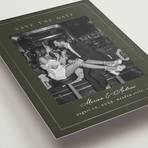 This is a olive foil stamped save the date cards with foil pressed by Nicole Walsh called refined printing on recycled smooth signature in standard