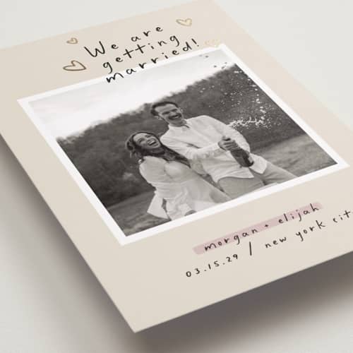 This is a nero foil stamped save the date cards with foil pressed by Pati Cascino called surprise! printing on recycled smooth signature in standard