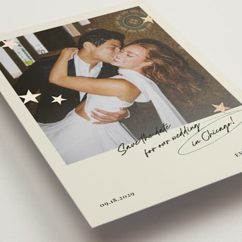 This is a buttercream foil stamped save the date cards with foil pressed by Helena Vitto called stars printing on recycled smooth signature in standard