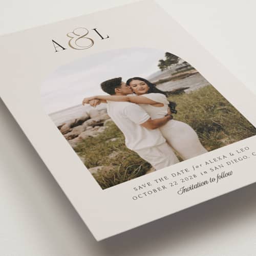 This is a cream foil stamped save the date cards with foil pressed by Robert and Stella called skye printing on recycled smooth signature in standard