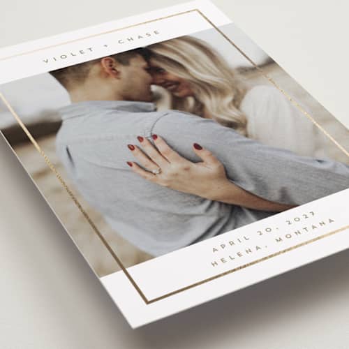 This is a latte foil stamped save the date cards with foil pressed by Rebecca Durflinger called contempo frame printing on recycled smooth signature in standard