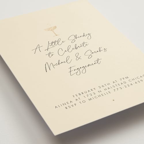 This is a champagne engagement party invitations with foil pressed by mo kelley called a little shindig printing on signature in standard
