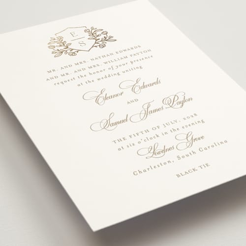 This is a ivory foil stamped wedding invitations with foil pressed by Mansi Verma called gold crest printing on signature in standard