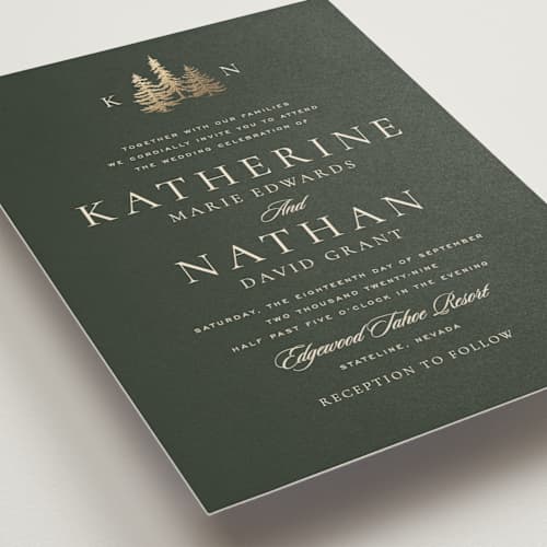 This is a pine foil stamped wedding invitations with foil pressed by Stacy Maalouf called gilded forest printing on signature in standard