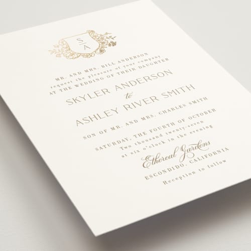 This is a champagne foil stamped wedding invitations with foil pressed by Cass Loh called floral crest printing on signature in standard