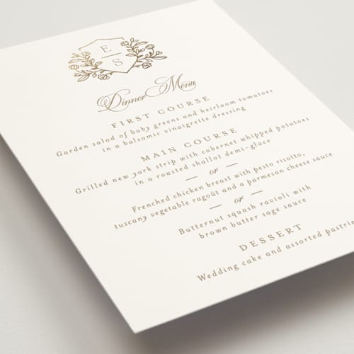 This is a ivory menu cards with foil pressed by Mansi Verma called gold crest printing on signature in 5x7