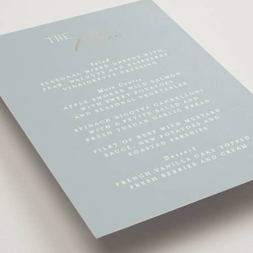 This is a dusty blue menu cards with foil pressed by Angela Thompson called delicacy printing on signature in standard