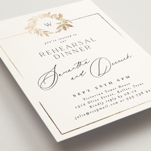This is a silk rehearsal dinner invitations with foil pressed by Phrosné Barwood called monogram wreath printing on signature in standard