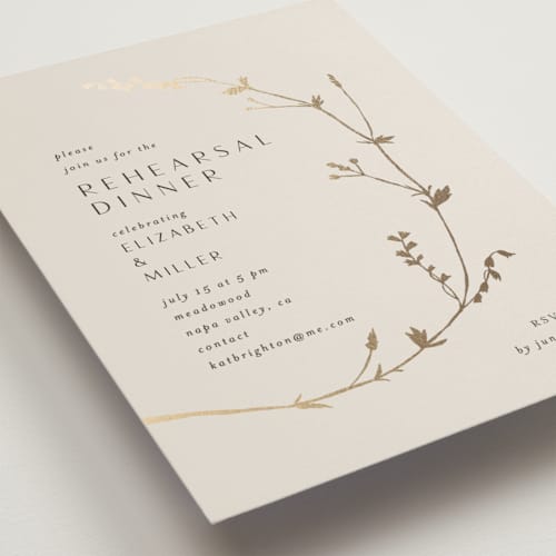 This is a champagne rehearsal dinner invitations with foil pressed by Amy Kross called vine wrap printing on signature in standard