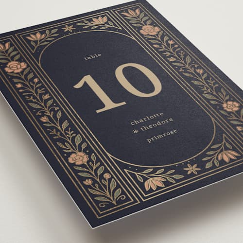 This is a navy table numbers with foil pressed by Jess Rosa Beck called botanical tapestry printing on doublethick in standard