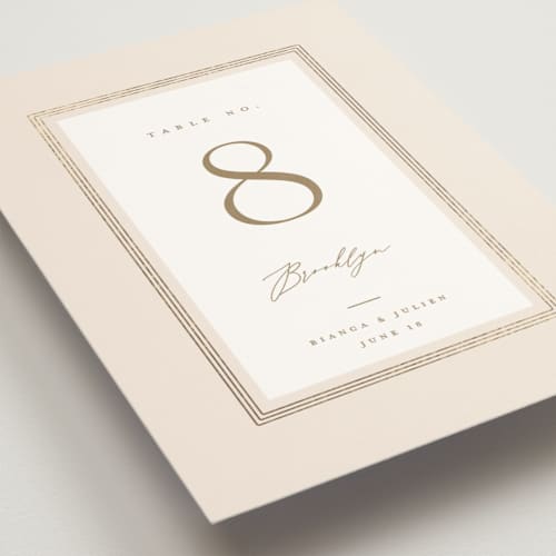 This is a latte table numbers with foil pressed by Kristie Kern called soleil printing on doublethick in standard
