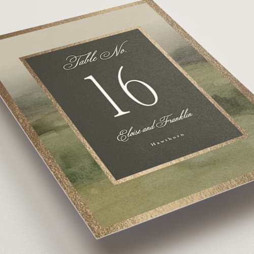 This is a graphite table numbers with foil pressed by Everett Paper Goods called hillside printing on doublethick in standard