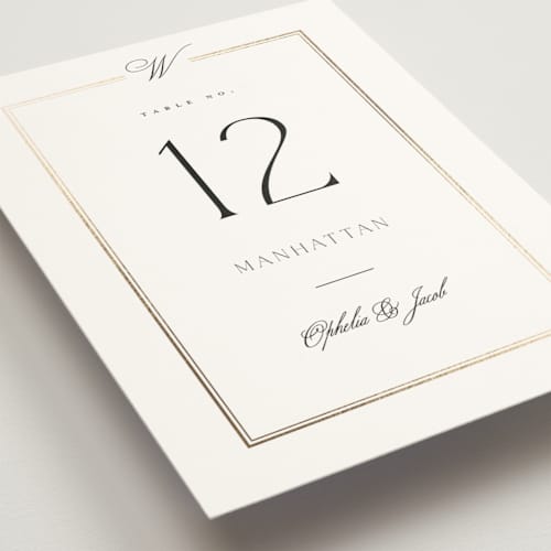 This is a pearl table numbers with foil pressed by Leah Bisch called elegant type printing on doublethick in standard