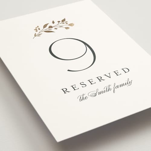 This is a cloudy table numbers with foil pressed by Jennifer Postorino called embrace printing on doublethick in standard