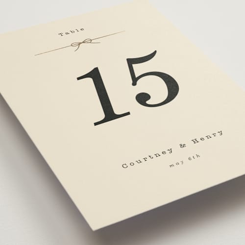 This is a ivory table numbers with foil pressed by Baumbirdy called bow tie printing on doublethick in standard