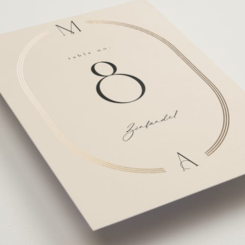 This is a latte table numbers with foil pressed by Kristie Kern called misha printing on doublethick in standard
