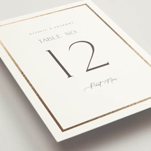 This is a porcelain table numbers with foil pressed by Nicole Walsh called regal printing on doublethick in standard