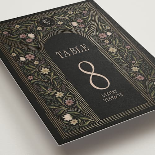 This is a noir table numbers with foil pressed by Randi Cirelli called emilie printing on doublethick in standard