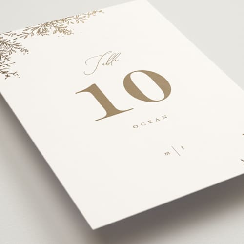 This is a porcelain table numbers with foil pressed by Leah Bisch called reflection printing on doublethick in standard