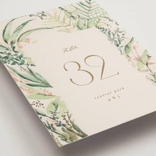This is a greenery table numbers with foil pressed by Phrosné Barwood called fresh tropical printing on doublethick in standard