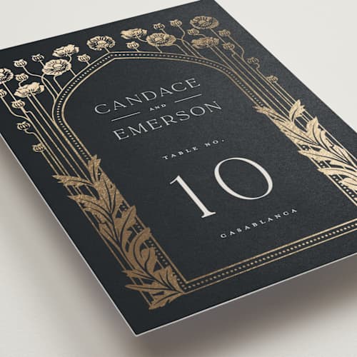 This is a navy table numbers with foil pressed by Ana de Sousa called nouveau flowers printing on doublethick in standard