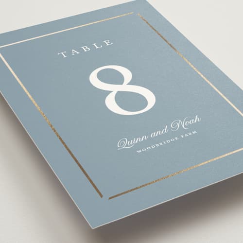 This is a dusty blue table numbers with foil pressed by Stacey Meacham called elegant bevel printing on doublethick in standard