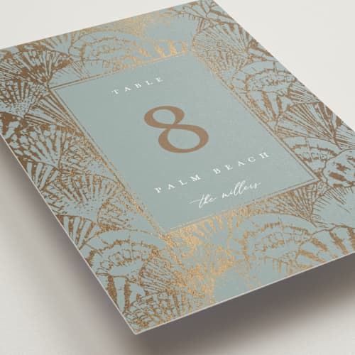 This is a ocean table numbers with foil pressed by Maria Alou called by the seashore printing on doublethick in standard