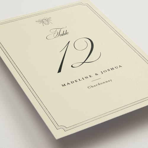 This is a cream table numbers with foil pressed by Jennifer Lew called honeybee printing on doublethick in standard