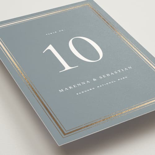 This is a mist table numbers with foil pressed by Wildfield Paper Co called hampton printing on doublethick in standard