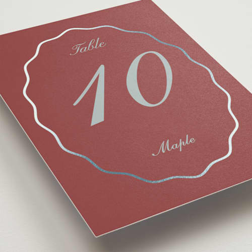 This is a burgundy table numbers with foil pressed by Baumbirdy called scallop frame printing on doublethick in standard