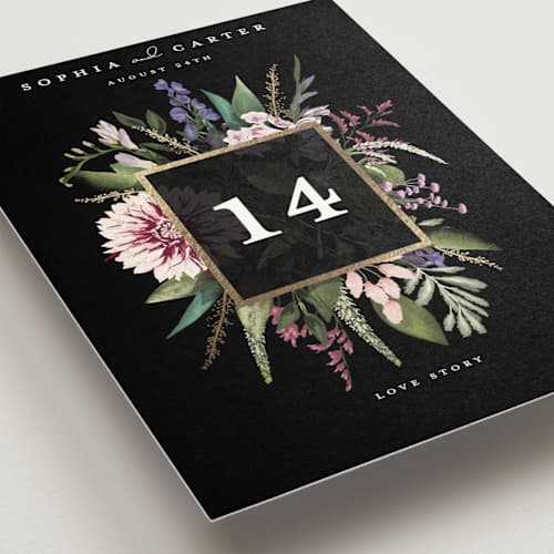 This is a midnight table numbers with foil pressed by Susan Moyal called bold bouquet printing on doublethick in standard