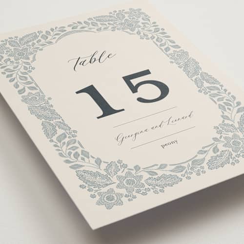 This is a dusty blue table numbers with standard by Jen Owens called embroidered printing on doublethick in standard
