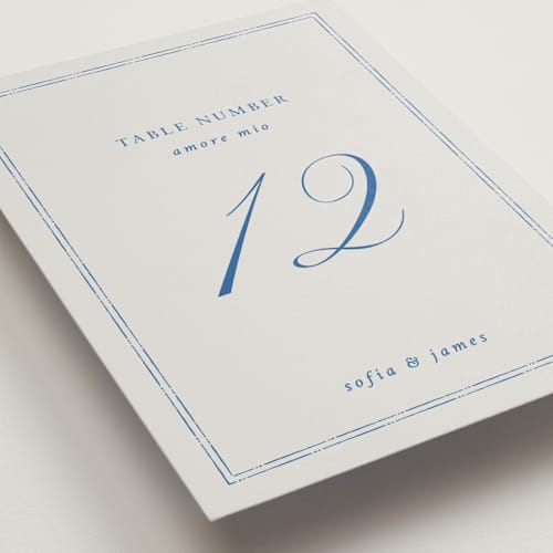 This is a blue mist table numbers with standard by Design Lotus called amalfi blue printing on doublethick in standard