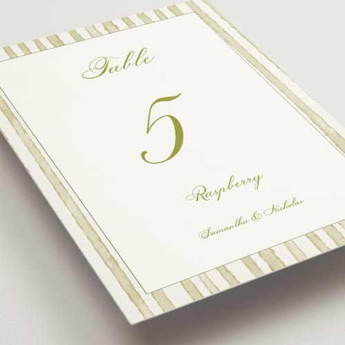 This is a cream table numbers with standard by Nicole Dragomir called wild berry watercolor printing on doublethick in standard