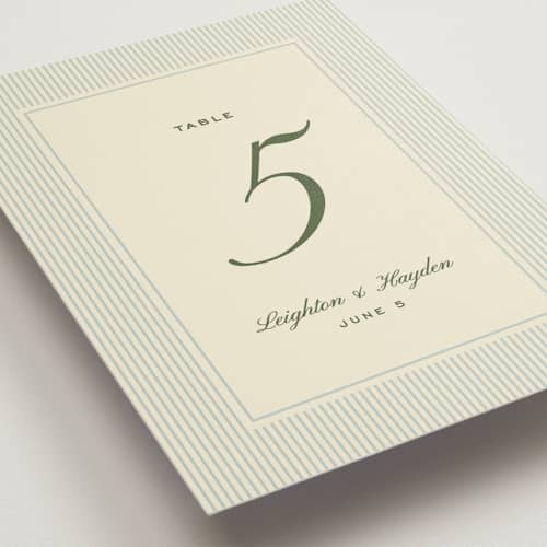 This is a pale blue table numbers with standard by Ellen Schlegelmilch called hayden printing on doublethick in standard