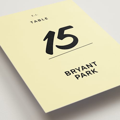 This is a butter table numbers with standard by Studio Suku called courthouse printing on doublethick in standard