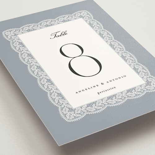 This is a dusty blue table numbers with standard by Erica Krystek called chantilly printing on doublethick in standard