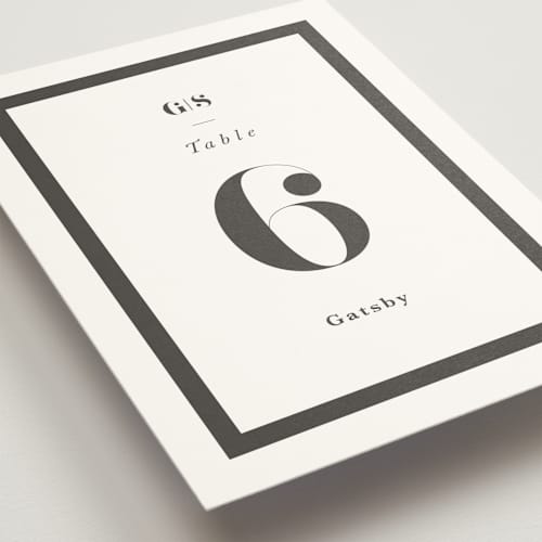 This is a charcoal table numbers with standard by Lori Wemple called monogram square printing on doublethick in standard