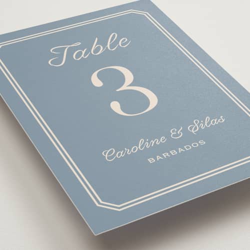 This is a french blue table numbers with standard by Carolyn MacLaren called bevel monogram printing on doublethick in standard