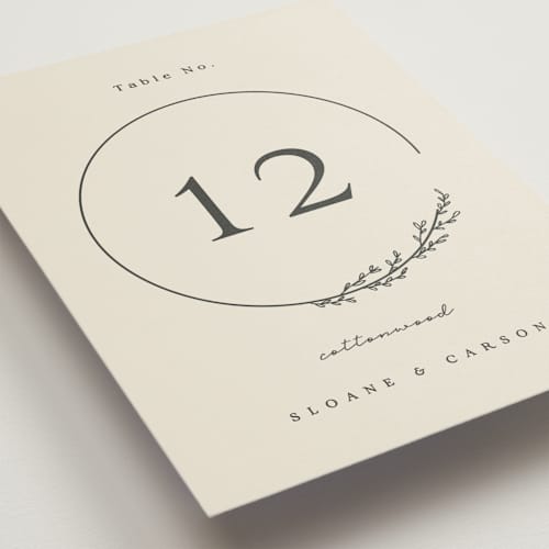 This is a almond table numbers with standard by Brianne Larsen called branched printing on doublethick in standard