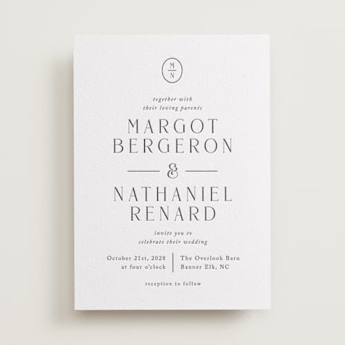 This is a soft black letterpress wedding invitations with letterpress by Olivia Raufman called minimalist monogram printing on white cotton in standard