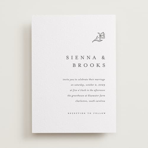 This is a soft black letterpress wedding invitations with letterpress by Pixel and Hank called floral cascade printing on white cotton in standard