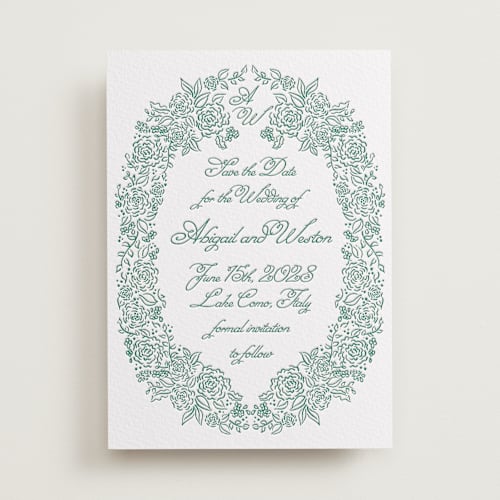 This is a evergreen save the date with letterpress by Tamara Hilje called crest florale printing on white cotton in standard