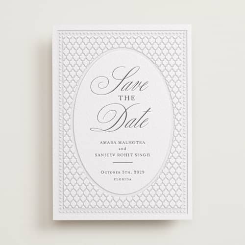 This is a soft black save the date with letterpress by Oma N. Ramkhelawan called kamal printing on white cotton in standard