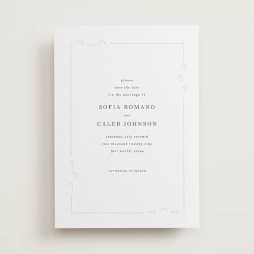 This is a slate save the date with letterpress by Vera Lim called cerchi printing on white cotton in standard