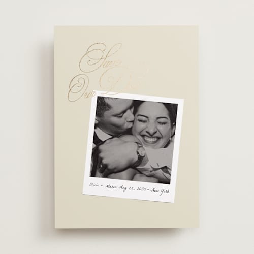 This is a linen foil stamped save the date cards with foil pressed by Lori Wemple called polaroid script printing on recycled smooth signature in standard